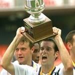 John Harkes holds up the MLS Cup trophy in his playing days with DC United