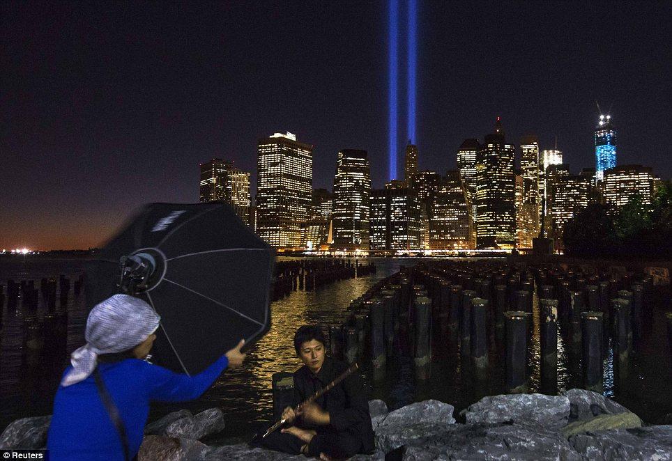 Viewpoint: Japanese flautist Toshi Bota is photographed on the shore of Brooklyn looking over to downtown Manhattan