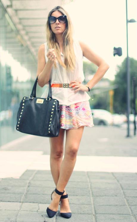Fashion blogger wearing scarf skirt and studded bag