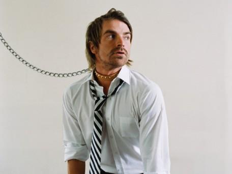 Office worker wearing a dog collar and lead