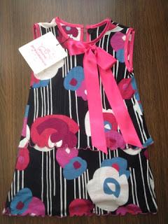 Ganadores de dos vestidos de niña cortesía de Divina Providencia