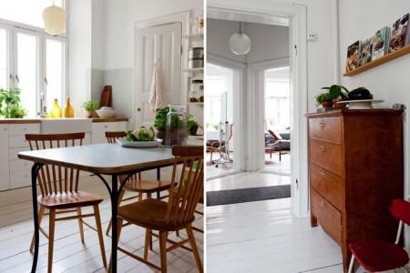 techos altos molduras suelo espigado madera roble salón comedor nórdico rodapíes altos madera revista hsm madrid puertas dobles paneladas blancas paredes paneladas madera muebles de diseño mobiliario moderno mobiliario diseño grandes ventanales estilo nórdico elementos arquitectónicos clásicos diseño nórdico diseño escandinavo diseño de interiores delikatissen revista hsm madrid decoración nórdica decoración interiores nórdico 