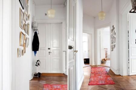 techos altos molduras suelo espigado madera roble salón comedor nórdico rodapíes altos madera revista hsm madrid puertas dobles paneladas blancas paredes paneladas madera muebles de diseño mobiliario moderno mobiliario diseño grandes ventanales estilo nórdico elementos arquitectónicos clásicos diseño nórdico diseño escandinavo diseño de interiores delikatissen revista hsm madrid decoración nórdica decoración interiores nórdico 