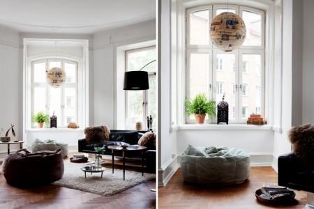 techos altos molduras suelo espigado madera roble salón comedor nórdico rodapíes altos madera revista hsm madrid puertas dobles paneladas blancas paredes paneladas madera muebles de diseño mobiliario moderno mobiliario diseño grandes ventanales estilo nórdico elementos arquitectónicos clásicos diseño nórdico diseño escandinavo diseño de interiores delikatissen revista hsm madrid decoración nórdica decoración interiores nórdico 