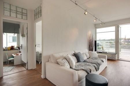 suelo de roble teñido grandes ventanales estilo nórdico estilo escandinavo diseño nórdico diseño de interiores diseño de áticos diáfanos decoración nórdica decoración falta de intimidad decoración de interiores y aticos cocina moderna cocina industrial cocina gris cocina en acero inoxidable carpintería de calidad decoración calefaccion por suelo radiantes blog decoración blog de interiores atico nórdico con vistas 