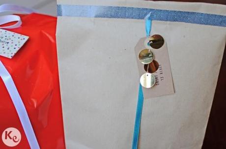 wrapping up presents-kraft, ribbon and big sequins wrapping up presents-kraft, ribbon and big sequins