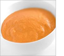 Bacalao confitado con pimientos y romesco de piñones