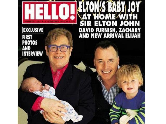 Elton John se luce en portada de revista con su segundo hijo Elijah