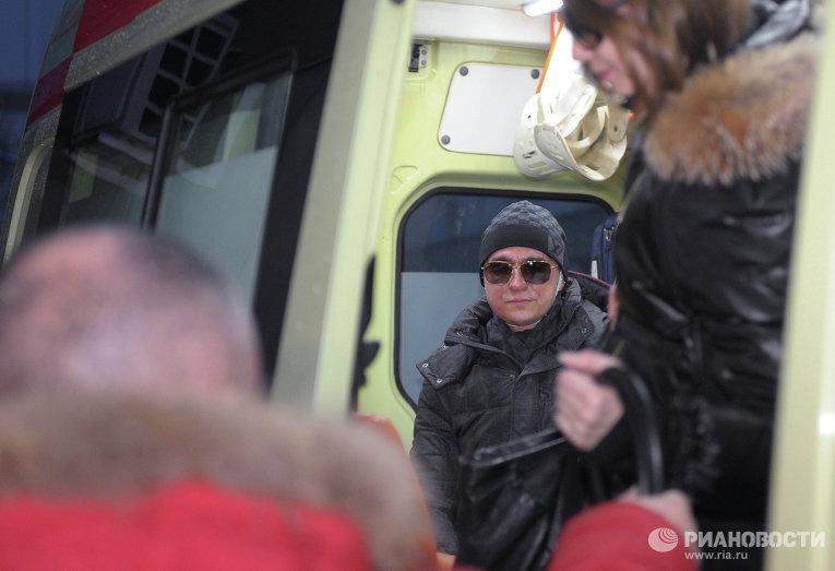 Sergei Filin sits in the ambulance after being discharged from the 36th hospital 