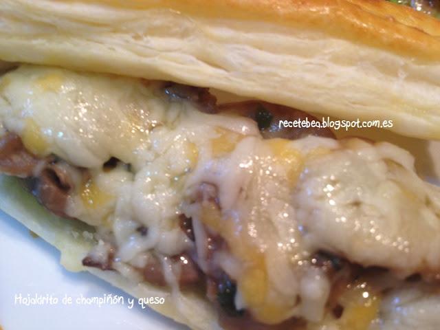 Hojaldrito con champiñón al ajillo y queso