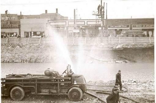 photo-chicago-chicago-fire-department-truck-firemen-stores-in-background-sepia-c1930