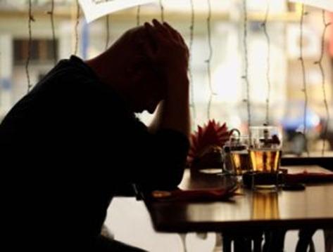 sad man sitting in restaurant