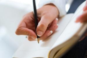 Woman writting hand with pencil