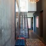Deco: Apartment in Brooklyn Athena-Calderone-stairway-hallway-concrete-wall-sputnik-Moroccan-rug-Bazaar-Feb13