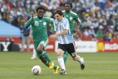 June 12, 2010 - South Africa - Football - Argentina v Nigeria FIFA World Cup South Africa 2010 - Group B - Ellis Park Stadium, Johannesburg, South Africa - 12/6/10..Argentina's Lionel Messi (R) and Nigeria's Lukman Haruna in action.