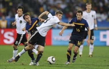 June 13, 2010 - South Africa - Football - Germany v Australia FIFA World Cup South Africa 2010 - Group D - Durban Stadium, Durban, South Africa - 13/6/10..Thomas Muller (C) of Germany in action with Richard Garcia of Australia (L.