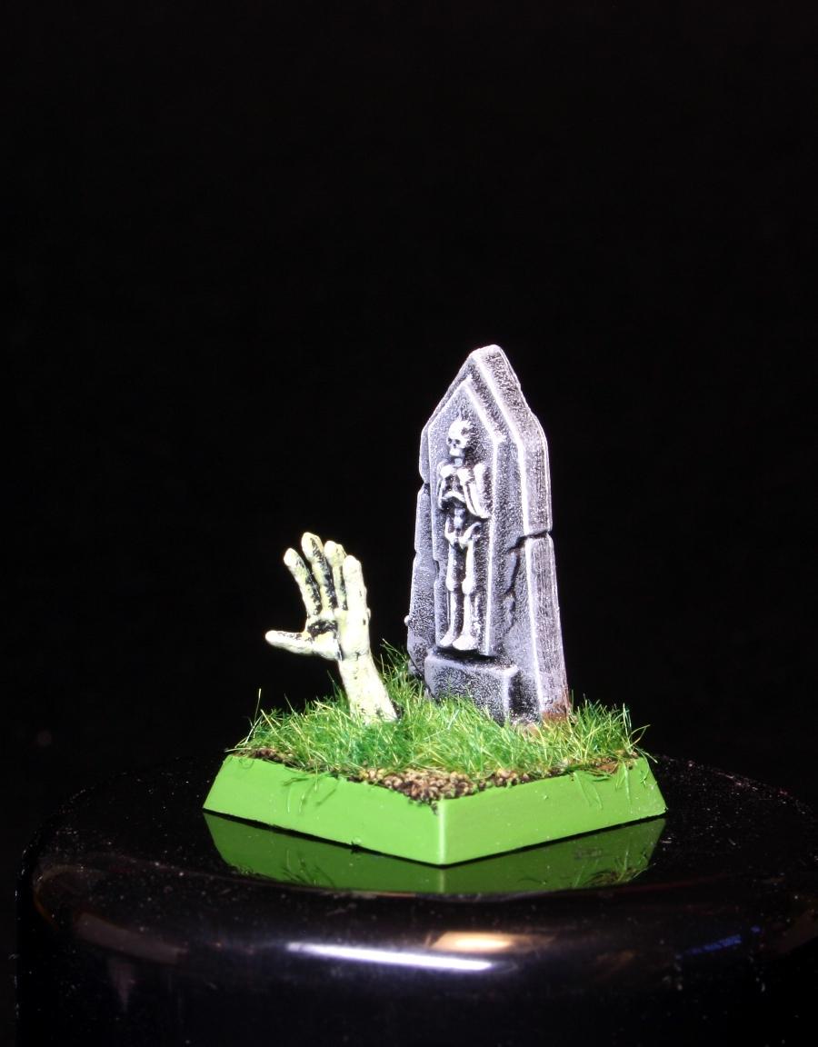 Zombi saliendo de su tumba