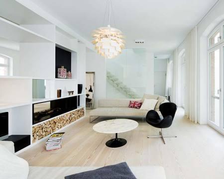 suelos de madera dinesen sofás piero lissoni sillón Swan de Arne Jacobsen mesa Tulip de Eero Saarinen lámpara Artichoke de Poul Henningsen diseño de interiores decoración nórdica escandinava decoración muebles de diseño decoración minimalista blog decoración nordica escandinava 