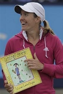 Stakhovsky y Henin, campeones en Hertogenbosch