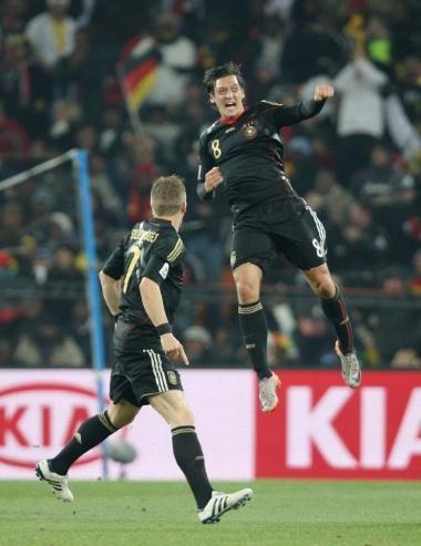 Football - Ghana v Germany FIFA World Cup South Africa 2010 June 23, 2010 - South Africa - Football - Ghana v Germany FIFA World Cup South Africa 2010 - Group D - Soccer City Stadium, Johannesburg, South Africa - 23/6/10..Mesut Ozil (R) celebrates scoring the first goal for Germany.