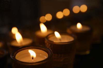 Germany, Schaeftlarn, View of candles for rogation in church, close up