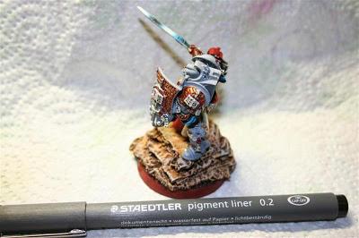 pintar letras a los pergaminos y libros de Lord Kaldor Draigo