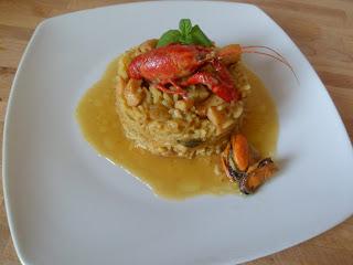 arroz con tiras de pota y cangrejos de rio