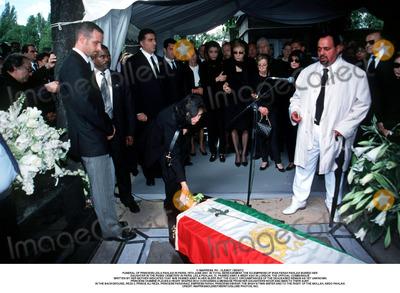 Farah Pahlavi, Passy, As Yet, Iman, Prince, Prince Ali Photo - IMAPRESS. PH : CLEMOT / BENITO.
FUNERAL OF PRINCESS LEILA PAHLAVI IN PARIS, 16TH JUNE 2001. IN TOTAL BEREAVEMENT, THE EX-EMPRESS OF IRAN FARAH PAHLAVI BURIED HER DAUGHTER IN THE PASSY CEMETERY IN PARIS. LEILA PAHLAVI, 31, PASSED AWAY A WEEK AGO IN LONDON. THE OFFICIAL COMMUNIQUE WRITTEN BY HER MOTHER INDICATED THAT SHE PASSED AWAY IN HER SLEEP, BUT THE EXACT CIRCUMSTANCES OF THE DEACEASED REMAIN AS YET UNKNOWN.
PRINCESS YASMINE PLACES A HEART SHAPED BOX CONTAINING A MESSAGE FROM HER DAUGHTERS NOOR AND IMAN TO THEIR AUNT. IN THE BACKGROUND, REZA II, PRINCE ALI REZA, PRINCESS FARAHNAZ, EMPRESS FARAH, PRINCESS ASHRAF, THE SHAH'S TWIN SISTER AND TO THE RIGHT OF THE MOLLAH, ABDO PAHLAVI.
CREDIT: IMAPRESS/CLEMOT/BENITO/GLOBE PHOTOS, INC.