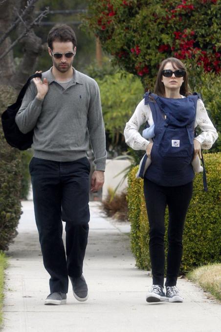 Natalie Portman carries her son Aleph in a Baby Bjorn carrier as she and fiance Benjamin Millepied are spotted out and about in Santa Monica