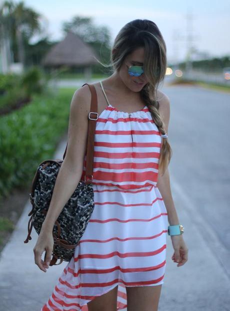 Wearing dress and backpack with mirrored sunglasses