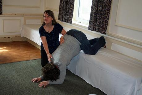 Bebé de nalgas... Qué puedo hacer!? Gail shows the forward-leaning inversion to class in New Bedford, Massachusetts.