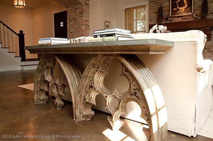 A zinc topped arched element console table sits behind the sofa, dividing the living area from the dining area. --  Cote de Texas