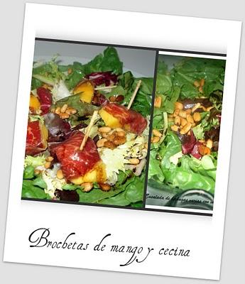 Brochetas de cecina y mango sobre lecho de lechugas con vinagreta de piñones