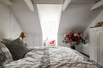 Estilo Rustico de una Vivienda en una Buhardilla