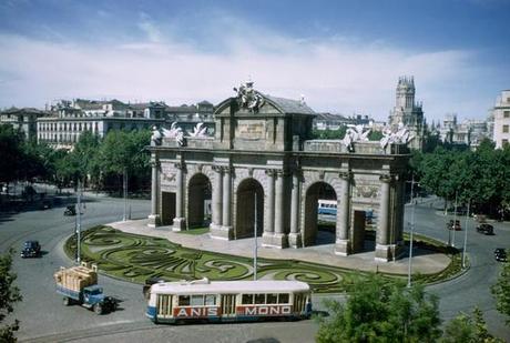 Madrid’s old city walls stands as monumental gate in traffic circle, December 1951.