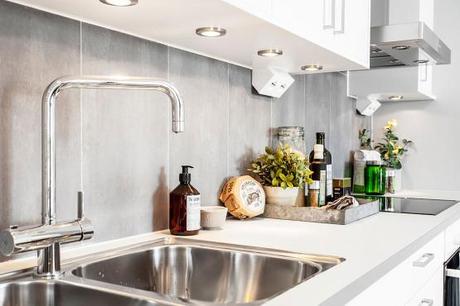 piso piloto decoración nórdica mesas de centro madera 3 patas distribución diáfana diseño piso piloto nordico diseño de interiores nórdicos decoración nórdica escandinava cocinas modernas pequeñas cocinas modernas blanco y gris cocina comedor salón diáfano decoración blog decoración nórdica 