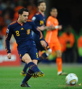 Spain's midfielder Xavi kicks the ball d