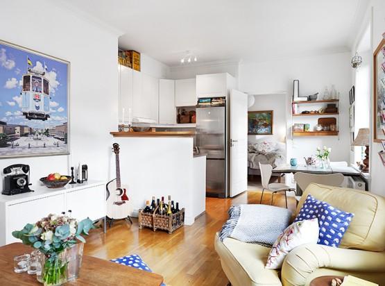 pisos pequeños de estilo nórdico dormitorio con almacenaje y rincón de trabajo diseño de interiores diáfano decoración nórdica escandinava decoración diseño mini pisos decoración diseño espacios pequeños decoración diseño de interiores cocina pequeña abierta blog decoración escandinava aprovechar espacio en piso pequeño 