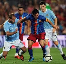 Manchester City - F.C. Barcelona, disputando un partido en Manchester
