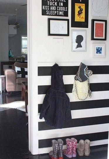 Black and white horizontal striped wainscot wall in an apartment – freshhome via Atticmag