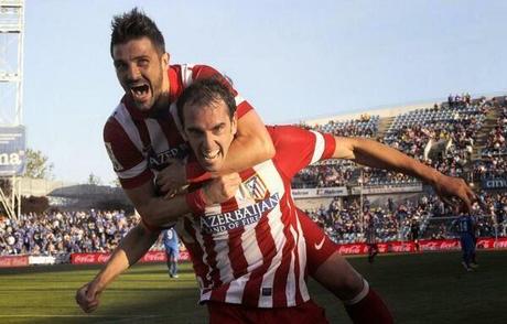 Godin y David Villa