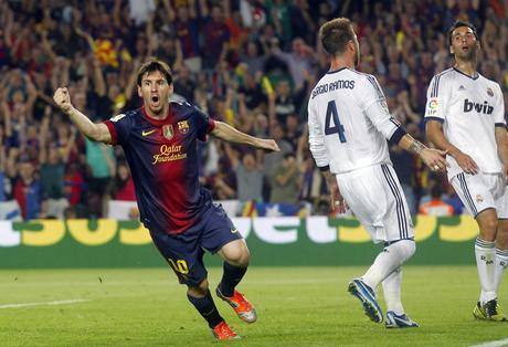 Barcelona's Messi celebrates next to Real Madrid's Ramos and Arbeloa after scoring a goal during their Spanish first division soccer match at Nou Camp stadium in Barcelona