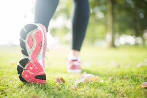 Close up picture of pink sole from running shoe in a park on a s