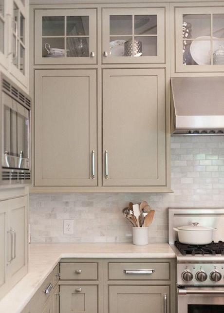 Neutral Painted Cabinets. Gray, greige, taupe, and gray greens offer a nice change to the stark white kitchens we’ve love but have seen over and over – the slightly warmer yet neutral hues feel elegant and refined.