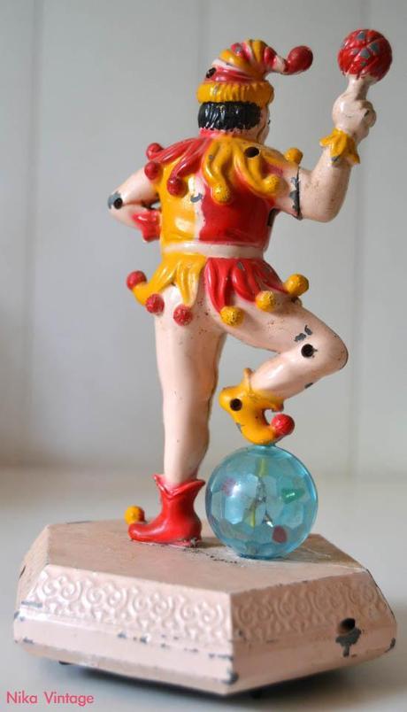 encendedor antiguo kistch retro mechero fantasia metal payaso inquierante carcajada luz