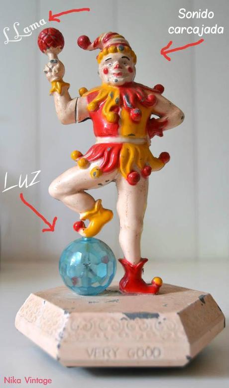 encendedor antiguo kistch retro mechero fantasia metal payaso inquierante carcajada luz