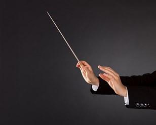 Music conductor with a baton