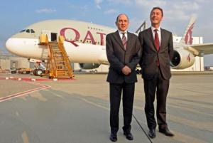 Al Baker CEO of Qatar Airways Group and Bregier CEO of Airbus pose in front of an Airbus A380  during delivery ceremony at Airbus headquarters in Hamburg-Finkenwerder