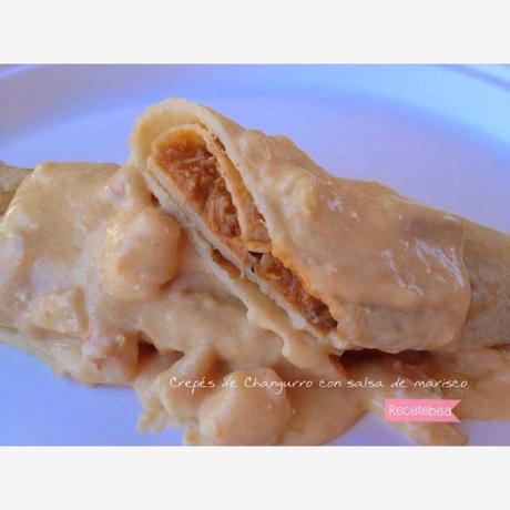 Crepes de changurro con crema de marisco.