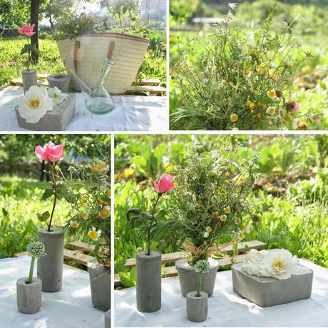 Mi niña decorando la mesa del picnic del huerto con un palet y los diy floreros de cemento2